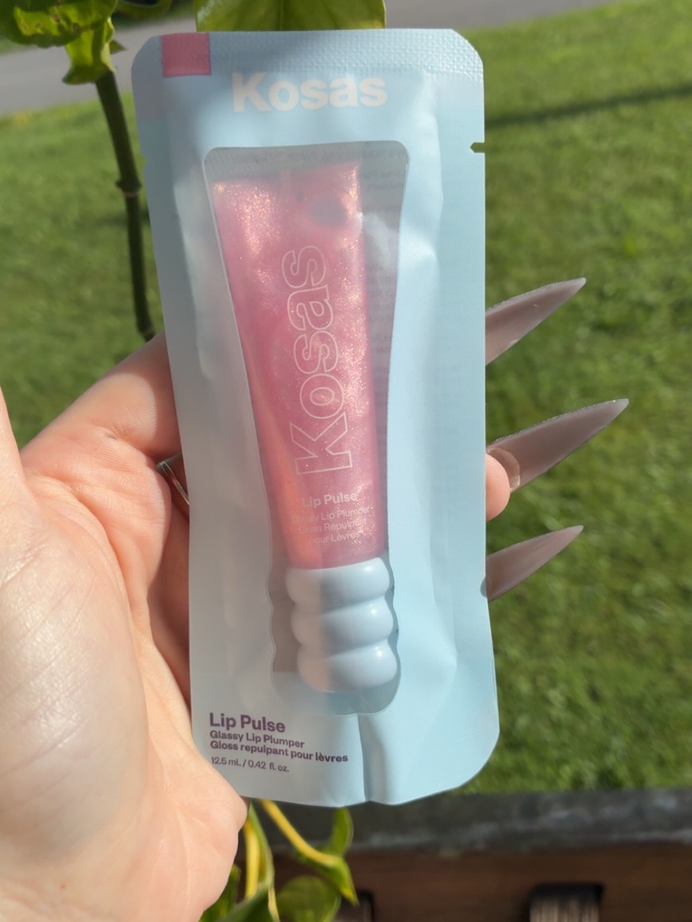 Kosas Lip Plumper Packaging in Pink and Teal